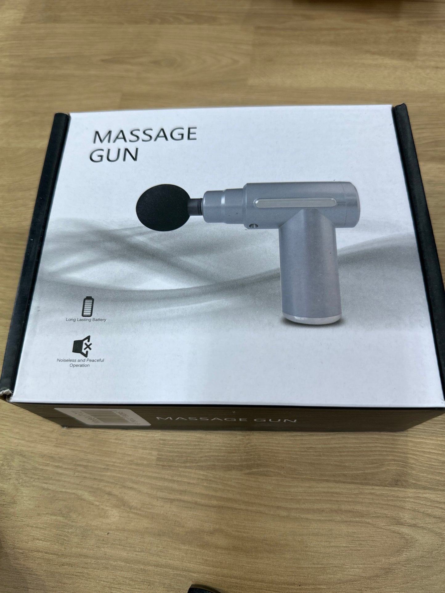 Pistola masajeador portátil